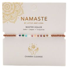 Unleash the healing powers of the Master Healer Namaste Bracelet by Lotus and Luna. Handcrafted by skilled female artisans in Thailand, the Master Healer Namaste Bracelet features a woven cotton slider cord that adjusts in size to fit wrists from 6.5 - 8.5" and is adorned with silver beads and a variety of semi-precious healing stones of Lapis Lazuli, Jade, Turquoise, Rose Quartz, Rhodolite, Agate, Garnet, Tiger's Eye and Jasper. Each Lotus and Luna Master Healer Namaste Bracelet exudes positive Mermaid Candles, Chakra Cleanse, Intention Bracelets, Turquoise Rose, Bath And Body Shop, Healing Jewelry, Healing Bracelets, Aromatherapy Candles, Tiger's Eye