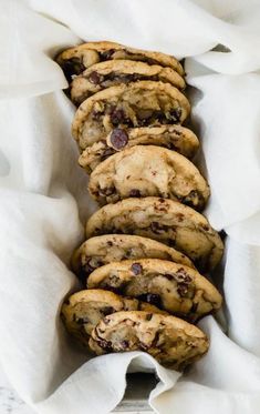 chocolate chip cookies in a white paper bag