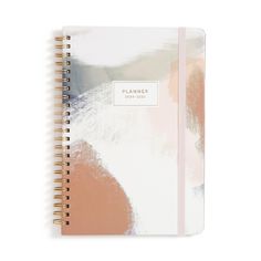 a planner book with an abstract design