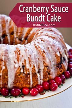 a cranberry sauce bundt cake with icing on a white platter