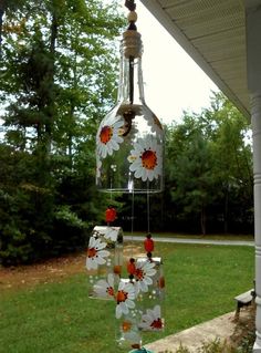 a wind chime hanging from the side of a house