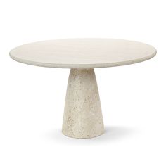 a white marble table with an oval base