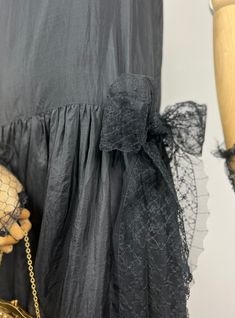 DETAILS - unlined - gathered drop waist - flapper style - no closure - silk - Christine Abbott London label - one long piece of lace, attached to the drop waist, can be worn as a bow or around the hips for a different style. Another piece of lace can be worn as a scarf or it can be added to the dress.   SIZE & MEASURES - fits size S/ M - pit to pit 46cm - length 1,18cm   CONDITIONS Excellent vintage condition. Black Art Deco Dress For Costume Party, Black Gatsby Style Dress For Vintage Events, Black Art Deco Summer Dresses, 1920s Style Black Summer Dress, 1920s Black Summer Dress, Black Art Deco Flapper Dress, Black Gatsby Flapper Dress For Vintage Events, Vintage Black Flapper Dress For Formal Occasions, Elegant Spring Flapper Dress For Costume Party