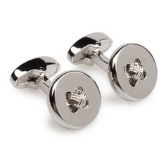 Buttons made from seashell were used in the Indus Valley Civilisation for ornamental purposes by 2000 BCE. Inspired by simplicity, we have crafted a handsome silver tone button cufflink pair. These Silver Button Cufflinks are a timeless piece of design, which is just as well, since the hardened rhodium and shine will last a long time to come. The Brothers at OTAA have downed many espressos to find the line between wearability and design.     Colour : Silver  Cufflink Style : 717-CL  Details Leng Luxury Elegant Cufflinks For Men, Cheap Elegant Cufflinks For Anniversary, Elegant Luxury Men's Cufflinks, Luxury Modern White Cufflinks, Luxury Men's Pants With Button Cuffs, Affordable Men's Formal Cufflinks, Luxury Classic Cufflinks, Luxury Polished Men's Cufflinks