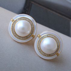 These stunning gold plated silver earrings feature a beautiful pair of hemisphere Mabe Pearl stones. With their intricate details and rich color, these push back studs are the perfect statement piece for any outfit. Handcrafted with care, these earrings are a true work of art and are sure to draw attention wherever you go. Whether you're looking for a unique gift or simply want to treat yourself. With their durable construction and timeless design, they're sure to become a beloved addition to yo White Gold-plated Earrings For Anniversary, White Gold Plated Earrings For Anniversary, Classic Gold Plated Round Clip-on Earrings, Classic Round Gold Plated Clip-on Earrings, White High Luster Earrings For Anniversary, Timeless White Earrings For Anniversary, White Gold Plated Round Bridal Earrings, Formal White Gold Plated Pearl Earrings, Formal White Gold-plated Pearl Earrings