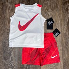 Tank Top Is Crew Neck, Dri-Fit, 100% Polyester, Nike Graphic On Chest. Shorts Are Pull-On, Elastic Waistband, 100% Polyester, Nike Logo Left Lower Leg. White Sports Sets For Summer, White Sleeveless Sports Set, Red Sports Sets For Spring, Nike White Summer Sets, Nike Sporty White Sets, White Nike Summer Sets, Sporty Red Sets For Spring, White Nike Playwear Sets, Nike Red Playwear Sets