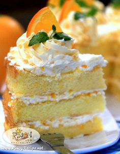 there is a piece of cake with oranges on top and whipped cream around the edges