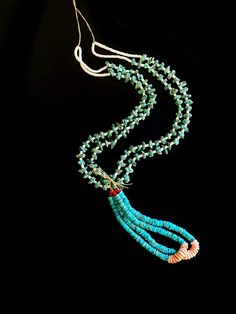 This necklace gets its namesake from the way it is made... The Traditional Way. If you found yourself standing within the Four Sacred Mountains you would feel right at home. Beautiful blue turquoise stones radiate the symbolism of the Blue World. When the Holy People see this necklace they know the Five-Fingered being wearing it knows where they come from. Two strands and two loops to represent all things male and female. White mother of pearl heishi beads bring balance, and the color white repr Navajo Traditional Necklace Turquoise, Blue Gemstone Beads Necklace, Spiritual Turquoise Pendant Necklace For Festival, Spiritual Single Strand Long Necklace, Turquoise Multi-strand Hand-strung Jewelry, Turquoise Multi-strand Necklace For Festivals, Turquoise Multi-strand Gemstone Necklaces, Turquoise Multi-strand Gemstone Necklace, Turquoise Gemstone Multi-strand Necklace