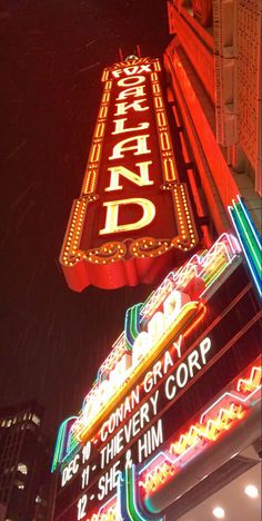 the marquee sign is lit up at night