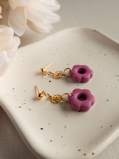 The floral vibes are strong with these tiny daisy drop earrings. Style these with your favorite white button up or floaty floral summer dress, the possibilities are endless. Get creative and have fun getting dressed! Perfect for everyday. -DETAILS- Materials: Polymer Clay, Gold Plated Hardware Color: Bubblegum Pink Length: About 1.25in -SHIPPING- All orders are shipped in a small shipping box via USPS First-Class Mail. Shipping upgrades are available at checkout. Due to various settings on your Summer Flower Earrings Gift Feminine Style, Summer Flower Earrings Gift, Feminine Summer Flower Earrings For Gift, Dainty Earrings With Flower Charm For Summer, Dainty Flower Earrings For Summer, Trendy Adjustable Flower Drop Earrings, Everyday Flower Charm Earrings For Spring, Everyday Flower Earrings With Charm For Spring, Everyday Flower Earrings With Spring Charm