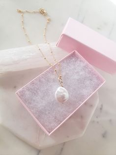 "This dainty necklace is a beautiful and classic touch to any outfit. Would be beautiful for a bride or with a casual outfit! A genuine freshwater pearl coin pearl is hand wrapped for the pendant. These pearls are shimmery and ethereal. They feature a rounded shape, though all are organically shaped and unique! Top quality dainty satellite chain adds a feminine touch, and is very durable. Handmade from top quality materials, choose from 925 Sterling Silver, 14k Gold fill or 14k Rose gold fill ch 14k Gold-filled Pearl Drop Necklace For Wedding, 14k Gold Filled Pearl Drop Necklace For Wedding, Wedding Pearl Drop Necklace In 14k Gold, 14k Gold-filled Pearl Pendant Necklace For Weddings, Delicate 14k Gold Filled Pearl Drop Necklace, Wedding Pearl Pendant Necklace In 14k Gold Filled, 14k Gold-filled Necklace With Pearl Charm For Wedding, 14k Gold Filled Necklace With Pearl Charm For Wedding, 14k Rose Gold Filled Necklaces With Pearl Pendant