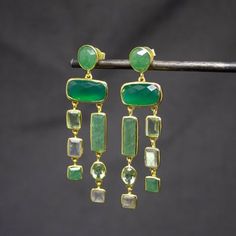 These gold vermeil chandelier earrings are embellished with faceted aventurine, green onyx, labradorite and green amethyst gemstones.  Wonderful statement earrings, handmade in sterling silver with 18ct gold plating and a stud fitting so they hang elegantly from the ear.  Dimensions (approx): * Length: 6cm * Width: 1.8cm Materials: * 18ct Gold Plated Silver * Aventurine * Green Onyx * Labradorite * Green Amethyst All of our pieces are handmade so please allow for slight variations in size and co Handmade Earrings Silver, Green Fusion Style Drop Chandelier Earrings, Fusion Style Green Chandelier Drop Earrings, Green Gemstone Dangle Earrings, Green Gemstone Dangle Chandelier Earrings, Elegant Green Gemstone Chandelier Earrings, Luxury Green Teardrop Gemstone Earrings, Gold Chrysoprase Gemstone Earrings, Luxury Green Gemstone Earrings