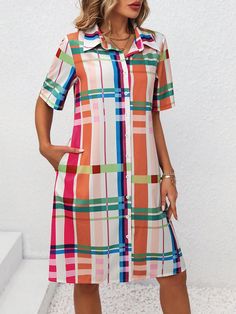 This Women's Colorful Grid Pattern Printed Shirt Dress features a bold and vibrant rainbow grid pattern, making it a chic and eye-catching addition to any wardrobe. Crafted with high-quality materials, this dress is not only stylish but also comfortable to wear. Elevate your fashion game with this statement piece. Color : Multicolor Style : Casual Details : Button, Pocket Type : Shirt Pattern Type : Plaid Sleeve Length : Short Sleeve Neckline : Collar Sleeve Type : Regular Sleeve Waist Line : Na Spring Rainbow Print Short Sleeve Dress, Spring Dresses With Rainbow Print And Short Sleeves, Casual Multicolor Shirt Dress For Summer, Multicolor Geometric Mini Dress, Multicolor Rainbow Print Dress, Casual Multicolor Rainbow Print Dress, Spring Multicolor Collared Shirt Dress, Casual Rainbow Print Dress For Spring, Rainbow Short Sleeve Dress For Spring