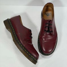 Brand: Dr. Martens Style: 3 Eye Leather Oxford Shoes Color: Cherry Red Condition: In Good Pre-Owned Condition. The Left Shoe Has Some Scuffing On The Inside Of The Shoe (Last Photo). See All Photos For Details And Wear. Size: Us Men's 10 -3-Eye Shoe -Trademark Yellow Welt Stitching -Leather Upper -Rubber Outsole Burgundy Leather Shoes With Red Sole And Plain Toe, Burgundy Leather Shoes With Red Sole, Classic Red Plain Toe Dress Shoes, Classic Red Dress Shoes With Plain Toe, Casual Red Leather Dress Shoes, Red Oxfords With Branded Insole For Derby, Burgundy Leather Lace-up Shoes, Classic Red Workwear Boots, Classic Red Closed Toe Oxfords