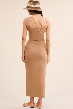 Elevate your style with our chic two-piece ensemble. Made from a luxurious ribbed-knit fabric, this form-fitting set includes a crop top with adjustable straps and square neckline, paired with a high-waisted midi skirt with a front slit. Enjoy comfort and elegance in this must-have outfit. PRE-ORDER 06/07/24 Fabric & fit: 50% VISCOSE 28% POLYESTER 22% NYLON Model is wearing size small. Skirts Midi High Waisted, Swimwear Sale, Square Necklines, Square Neckline, Pre Order, Skirt Set, Ribbed Knit, Knit Fabric, Knitted Fabric