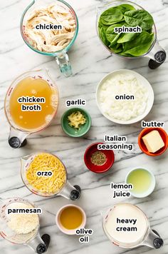 ingredients for chicken broth laid out on a marble counter top with the names labeled