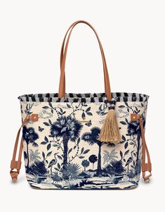 Whether traveling by air, land or sea, this tote will be your favorite new companion. This bag boasts a deep, spacious interior a large zippered pocket on one side and three slip pockets on the other. A beautifully crafted hook closure and signature Spartina mermaid finish the look. Wherever your day takes you, this ba Sjp Style, Lowcountry Style, River Landscape, Spartina 449, Tote Bag Purse, Retail Therapy, Bags Designer Fashion, Luggage Bags, Tote Handbags