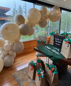 balloons and gift bags are on display in the lobby