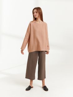 "RUMI is a long sleeve loose fit linen blouse. DETAILS - Oversized fit - Long sleeves - Boat neckline - 100% lightweight European linen fabric - Cut and sewn to order just for you in our studio COLOR - Camel, you can also choose other colors above - Fabric samples are available here https://www.etsy.com/listing/586569696/linen-fabric-samples SIZING & FIT - Relaxed, loose fit - Length is approximately 26 inches / 66 cm - Bust is approximately 26.5 inches / 67 cm - Measurements taken from a si Oversized Long Sleeve Beige Blouse, Oversized Long Sleeve Neutral Top, Neutral Relaxed Fit Long Sleeve Blouse, Beige Long Sleeve Blouse With Relaxed Fit, Oversized Neutral Blouse For Fall, Relaxed Fit Long Sleeve Blouse In Flax Color, Flax Long Sleeve Relaxed Fit Blouse, Beige Linen Long Sleeve Top, Versatile Long Sleeve Beige Blouse