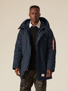 A N-3B mod parka inspired from US Navy jacket detailing. Suit up for winter with a snug parka built to last. The snorkel hood, a classic feature of the N-3B, has been modified to include an adjuster and wire edge. With a water resistant shell, channel-quilted lining, and hand warmer pockets, this US Navy-inspired mod parka is especially suited to the most extreme climates. Male Model Information - Black: Height: 6'0" Size: Large Male Model Information - Gunmetal & Replica Blue: Height: 6'1" Size Us Navy Jacket, Men Parka, Navy Jacket, Suit Up, Us Navy, Mens Outerwear, Military Fashion, Hand Warmers, Male Model