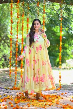 PRODUCT DESCRIPTION :-Presenting Yellow floral Printed chiffon tiered pattern Anarkali with matching Chiffon dupatta and cotton Pants . The Yellow shade of the Anarkali and Floral Print is perfect pick for your ethnic wardrobe . Anarkali :- Chiffon Pant :- CottonDupatta :- ChiffonClosure Used:- Side zipColor:- YellowCare Instructions :- Dry clean onlyModel Size :- Model is wearing XS sizeModel Height :- 5.6''DISCLAIMER :- Slight color variations may occur due to different screen resolution. Bohemian Georgette Anarkali Set For Diwali, Bollywood Style Yellow Floral Print Sharara, Bohemian Georgette Anarkali Set With Printed Motifs, Bohemian Anarkali Set With Printed Motifs, Yellow Floral Anarkali Set, Yellow Floral Print Anarkali Set, Diwali Floral Print Maxi Sharara, Bohemian Georgette Anarkali Set For Festivals, Floral Print Georgette Anarkali Set