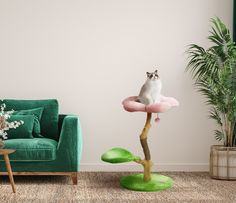 a cat sitting on top of a fake tree in the middle of a living room