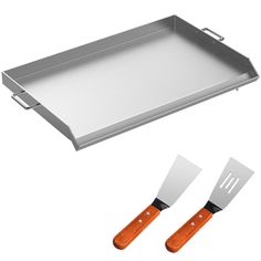 two knives and a tray on a white background