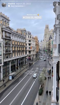 an aerial view of a city street with tall buildings