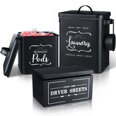 three different types of black containers with labels on them and one is filled with candy