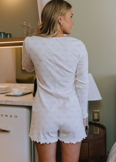 Tap into the ultimate coquette girl aesthetic with our pointelle pajama sets. Our Pointelle Playsuit is designed in soft 100% cotton fabric with our new bow print, coming in light pink/pink and white/light blue. Extremely soft and lightweight, this buttery pointelle fabric provides subtle stretch for the perfect true to size fit. Playsuit romper with 4 button front closure & subtle scallop neckline Light pink body with pink bow print White body with light blue bow print Ruffled lettuce edges on Fitted Feminine Long Sleeve Sleepwear, Fitted White Sleepwear For Sleepover, White Fitted Sleepwear For Loungewear, White Fitted Sleepwear For Pajama Party, Feminine White Lounging Sleepwear, White Fitted Sleepwear For Lounging, Feminine Fitted Sleepwear For Loungewear, Bridesmaid Pyjamas, Sleep Accessories