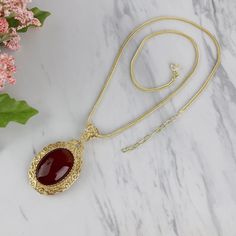 Handmade 18k Gold Plated Sterling Silver Filigree Pendant with Genuine Carnelian Gemstone & 18k Gold Plated Silver Pendant Material: 925 Solid Sterling Silver Finishing: 18k Yellow Gold Plated over Sterling Silver Natural Genuine Carnelian Gemstone, 18 mm x 25 mm, Oval, Cabochon Pendant Length: 2 inches Width: 1.10 inches Chain: !8k Gold Plated over Sterling Silver Foxtail chain with spring ring clasp Comes with a gift pouch and box Free Domestic Shipping We hope that you enjoy our exclusive art Formal Carnelian Oval Cabochon Jewelry, Formal Oval Cabochon Carnelian Jewelry, Gold Hallmarked Oval Cabochon Necklaces, Gold Agate Jewelry With Large Pendant, Gold Agate Hallmarked Jewelry, Elegant Carnelian Round Pendant Jewelry, Elegant Carnelian Pendant Necklace, Elegant Amber Oval Cabochon Necklace, Formal Gold Carnelian Jewelry