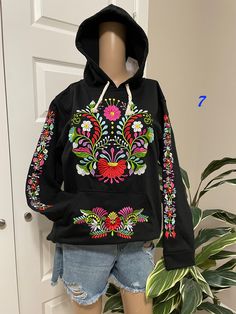 "Amazing pullover sweaters! Embroidered Mexican Sweaters.. Size MEDIUM  Each sweater has its unique design - Cotton Material Beautiful Floral Authentic Sweater from Chiapas, Mexico. Our Mexican Partners take pride in their work, and these is one of their best pieces. All the embroidered work has a professional and skilled finish. CARE DETAILS: Hand wash only Delicate care Hang dry Don't miss out, make a very special gift for a very special friend, or buy it for you for that special celebration. Spring Hooded Top With Embroidered Logo, Embroidered Hooded Sweatshirt For Winter, Spring Sweater With Multicolor Embroidery And Long Sleeve, Hooded Embroidered Sweatshirt For Winter, Multicolor Embroidered Long Sleeve Spring Sweater, Casual Winter Sweater With Floral Embroidery, Winter Black Embroidered Tops, Casual Long Sleeve Sweater With Floral Embroidery, Casual Multicolor Embroidered Sweater