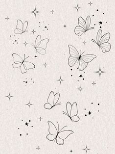 some black and white butterflies flying through the air with stars in the sky behind them