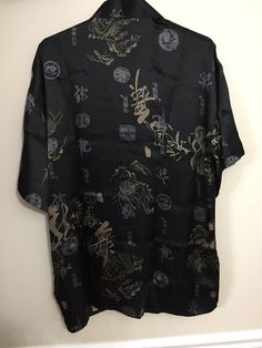 Woman's Kimono inspired by a cardigan jacket with Chinese knot button closures. Size: XXL 185/104B Never used. Don't hesitate to reach out if you have any questions about this item! We don't usually accept returns, but please reach out if there is any problem with your order. Casual Black V-neck Kimono, Casual Black Kimono With Short Sleeves, Casual Black Tops With Kimono Sleeves, Casual Printed Black Kimono, Casual Black Printed Kimono, Casual Black Kimono With Relaxed Fit, Casual Black Relaxed Fit Kimono, Chinese Kimono, Knot Button