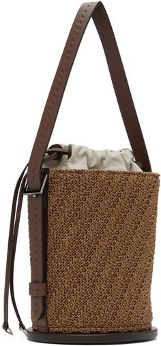 Structured woven faux-raffia and buffed calfskin top handle bag in tan. · Adjustable and detachable carry handle · Adjustable and detachable crossbody strap · Logo hardware at face · Bumper pads at base · Drawstring closure · Patch pocket at interior · Canvas lining · H7.5 x W6 x D5.5 Supplier color: Tobacco Chic Brown Bucket Bag With Intrecciato Weave, Brown Top Handle Straw Bag, Luxury Brown Straw Bag With Detachable Strap, Brown Double Handle Straw Bag With Detachable Strap, Brown Top Handle Bucket Bag With Woven Leather, Brown Rectangular Bucket Bag With Intrecciato Weave, Leather Top Handle Straw Bag With Detachable Strap, Beige Top Handle Bucket Bag With Intrecciato Weave, Beige Bucket Bag With Intrecciato Weave And Top Handle