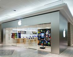 an apple store is shown in the middle of a shopping mall with its doors open