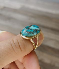 14k gold filled turquoise ring. 14 karat gold filled sterling silver and 13mm x 17.5mm stabilized copper infused turquoise. The band is 4mm. This ring is available in whole sizes. Material: 14k gold filled Sterling Silver Stone Size: 13mm x 17.5mm Coming with gift box RETURN POLICY : For any reason, if you are not satisfied with our product, you may return your order within 10 days from the date of shipment received. The item must be returned in its original condition. Shipping charges are not r Big Turquoise Ring, Turquoise Gold Ring, Turquoise Ring Silver, Gemstone Jewellery, Sterling Silver Hoops, Natural Turquoise, Ring Sterling Silver, Minimalist Earrings, Huggies Earrings