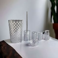 an assortment of glassware on a white table