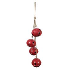 three red balls hanging from a string