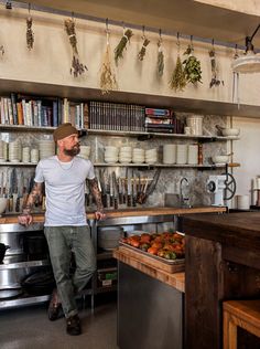 a man standing in front of a kitchen counter