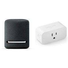 an amazon smart outlet plug next to a white and black box with the amazon logo on it