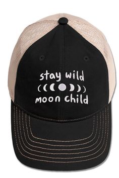 Follow the moon and dance with the stars as you wear this Stay Wild Moon Child Baseball Cap! Your inner moon child will love the moon phases embroidered design and the STAY WILD MOON CHILD text. Features a flexible, soft finish and an adjustable snap back with a head circumference of 20.5 inches to 24 inches. Black with Natural, breathable mesh back. 100% Cotton Twill with mesh back. Lightweight Adjustable Baseball Cap Trucker Hat, Comfortable Adjustable Baseball Cap, Adjustable Comfortable Baseball Cap, Lightweight Adjustable Trucker Baseball Cap, Adjustable Embroidered Black Trucker Hat, Adjustable Black Embroidered Trucker Hat, Comfortable Adjustable Baseball Cap With Curved Brim, Adjustable Comfortable Baseball Cap With Curved Brim, Comfortable Adjustable Curved Brim Baseball Cap