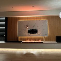 a living room filled with furniture and a flat screen tv on top of a wall