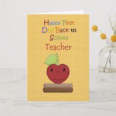 a card that says happy first day back to school teacher with an apple on it