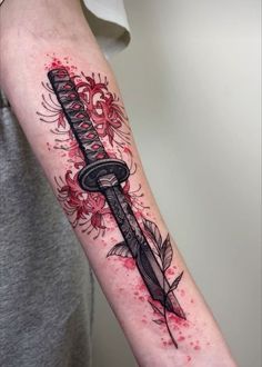 a tattoo with a dagger and flowers on it's arm, in red ink