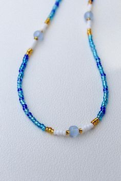 This beaded necklace is made with 14k gold-filled metal clasps Anti-tarnish Water safe Size: 16 inches long Everyday Beaded Necklace With Round Beads, Everyday Heishi Beaded Necklaces, Everyday Beaded Round Necklace, Everyday Beaded Choker With Round Beads, Heishi Beads Necklace With Polished Round Beads, Adjustable Single Strand Beaded Necklace With Oval Beads, Everyday Blue Beaded Necklace With Tiny Beads, Single Strand Beaded Choker For Jewelry Making, Handmade Ocean-inspired Beaded Necklace For Summer