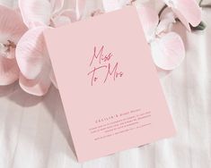 a pink card with the words miss to mrs written on it next to some flowers