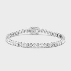 Serve some sparkle with this piece. It is the perfect tennis bracelet with an edgy twist. Modern White Gold Sterling Silver Tennis Bracelet, Modern Cubic Zirconia Tennis Bracelet With Brilliant Cut, Modern Silver Tennis Bracelet With Diamond Cut, Silver Oval Diamond Bracelet With Prong Setting, Silver Oval Diamond Bracelet With Brilliant Cut, Timeless White Gold Diamond Bracelet With Oval Links, Modern Round Diamond Tennis Bracelet, Timeless White Gold Diamond Bracelet, Modern White Gold Tennis Bracelet