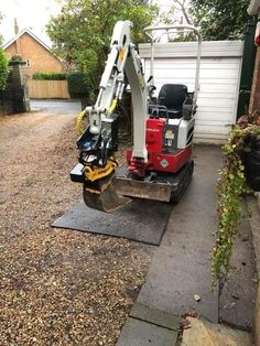 a small machine is parked in front of a house