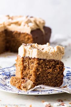 a slice of gingerbread sheet cake on a blue and white plate